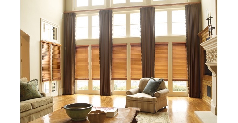 Miami great room with natural wood blinds and full-length draperies.